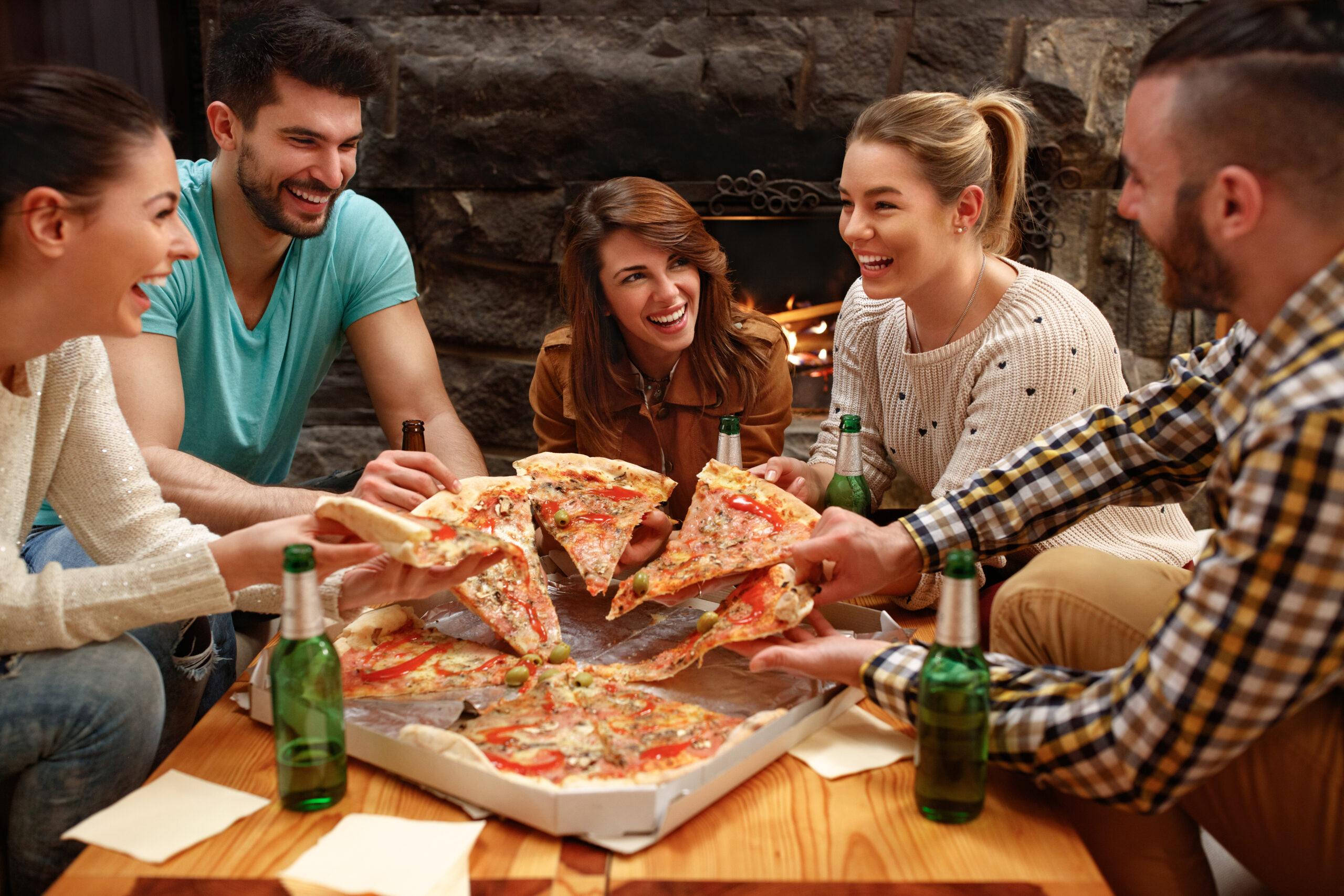 Group,Of,Young,Hungry,People,Taking,Pieces,Of,Big,Family